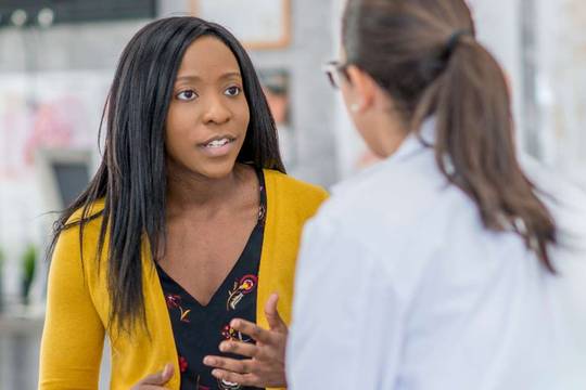 woman talking with her healthcare provider