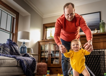 man walking with baby