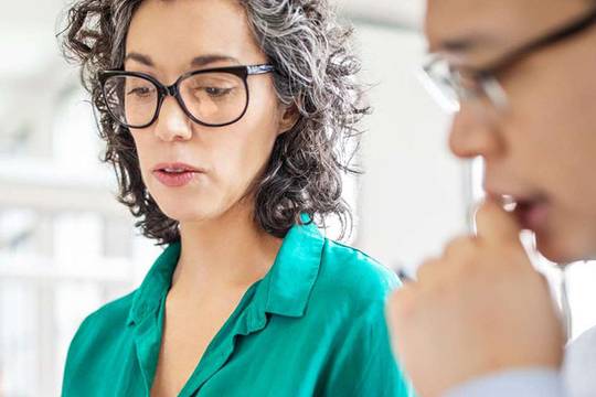 woman with glasses in business meeting